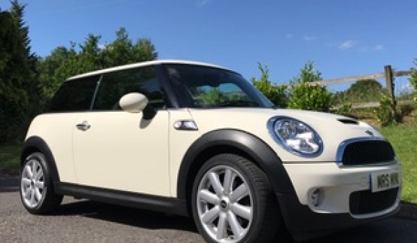 Mike chose this 2009 / 59 MINI Cooper S with Chili & Visibility Packs in Pepper White with Low Miles 26K & 1 Owner